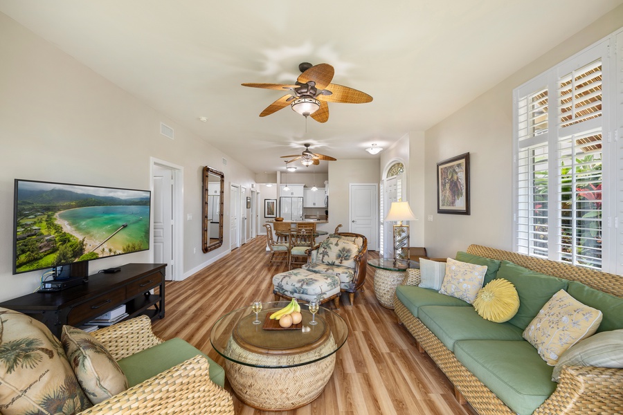 Relax in a bright and airy living room, perfect for enjoying island vibes with family and friends.