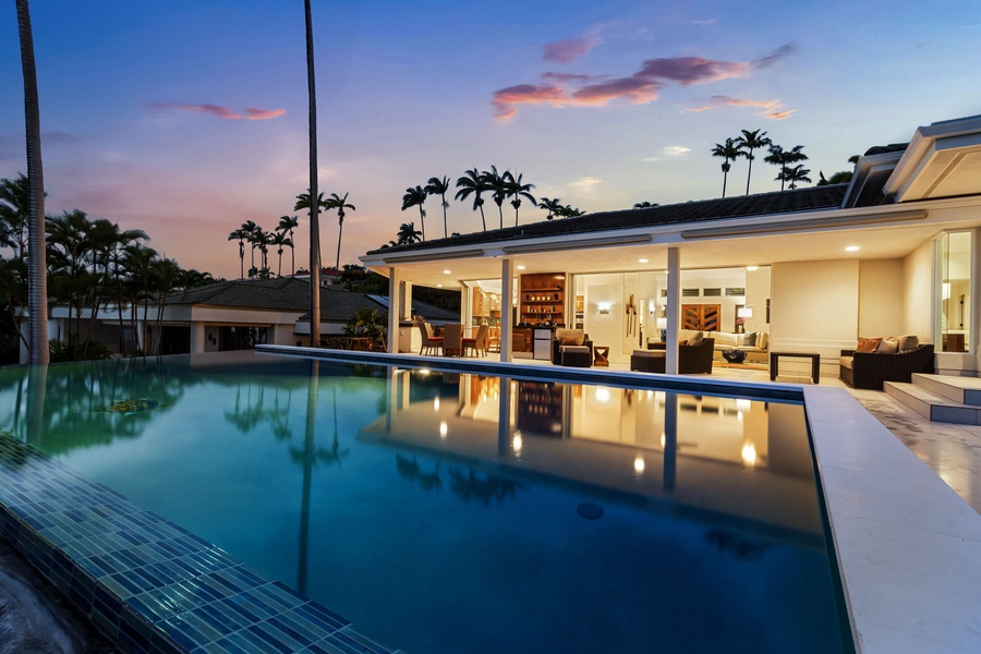 Framed by sunset hues, the pool becomes a front-row seat to paradise.