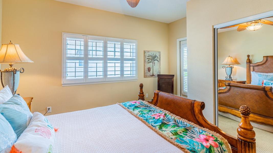 The second guest bedroom with a closet and lanai access.