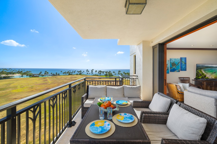 Enjoy meals with a view on this breezy lanai, overlooking the golf course and the endless blue sea.