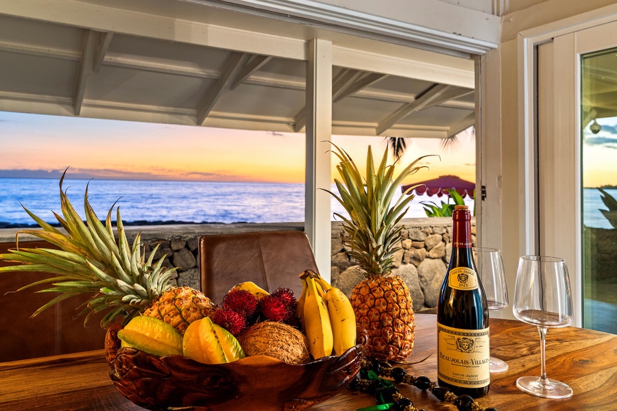 Tropical fruit, wine, and sunset views set the stage for unforgettable Kona evenings.
