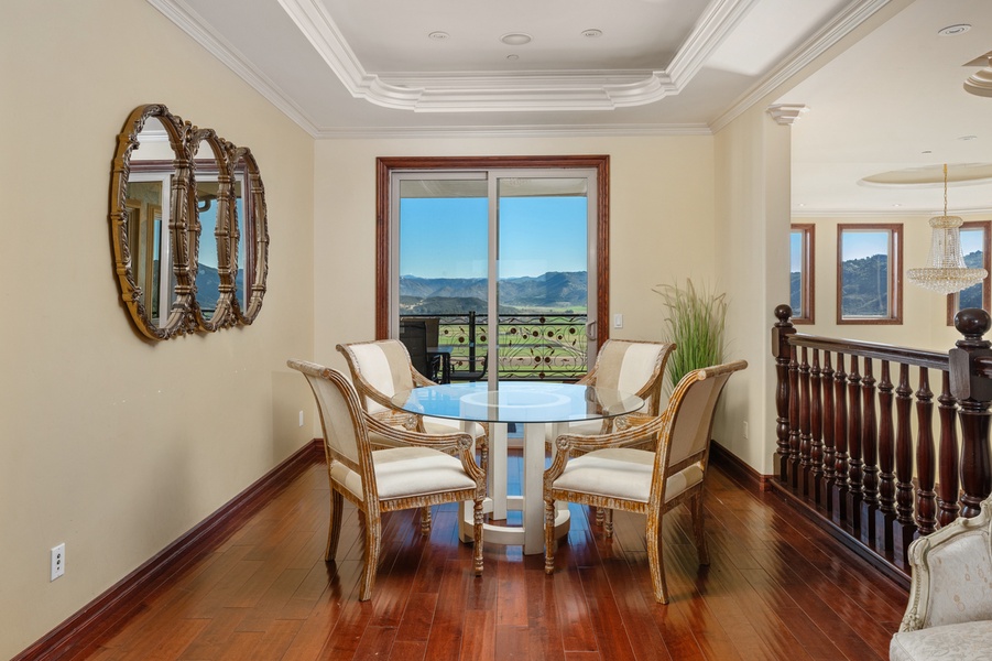 By the window, a round table waits for the conversations that outlast dinner.