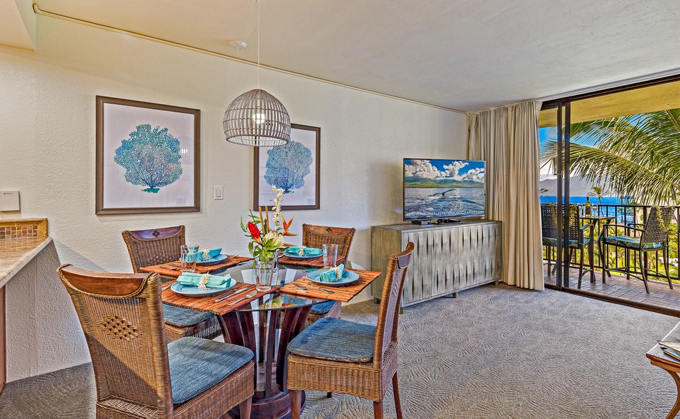 The inviting dining area, with comfortable seating for four, offers a cozy space for family meals or relaxed gatherings