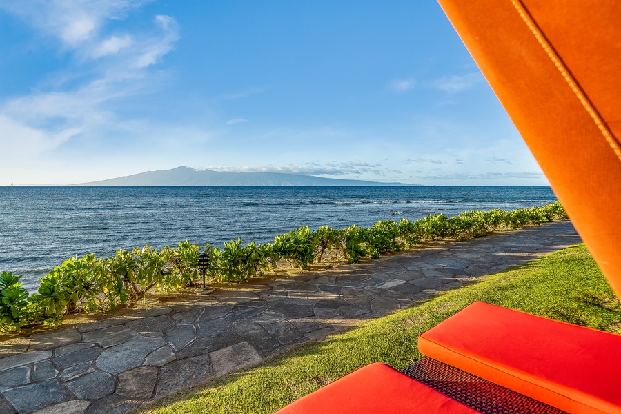 Unwind with Maui views from the resort lounge chairs at Kaanapali Shores.