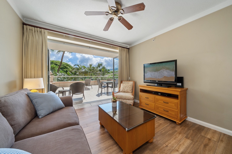 The living area in Honua Kai Konea 230/232 includes a queen sleeper sofa and easy lanai access