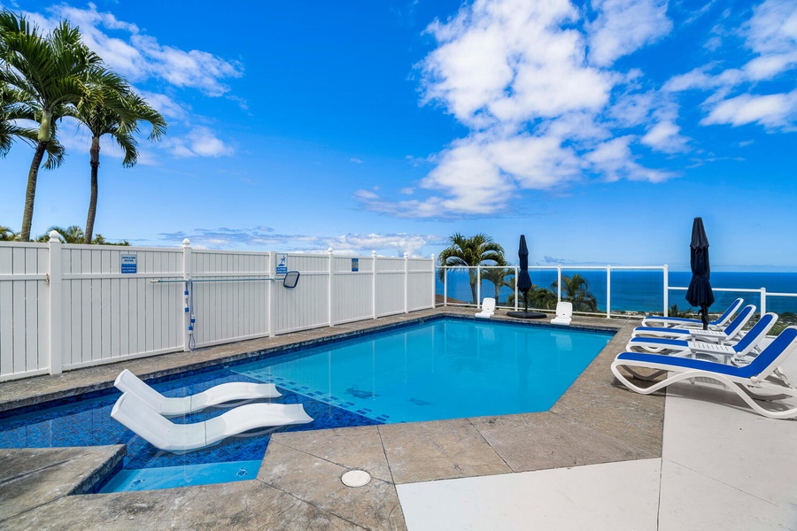 Lounge and relax by the shallow end of the pool at Honu O Kai.