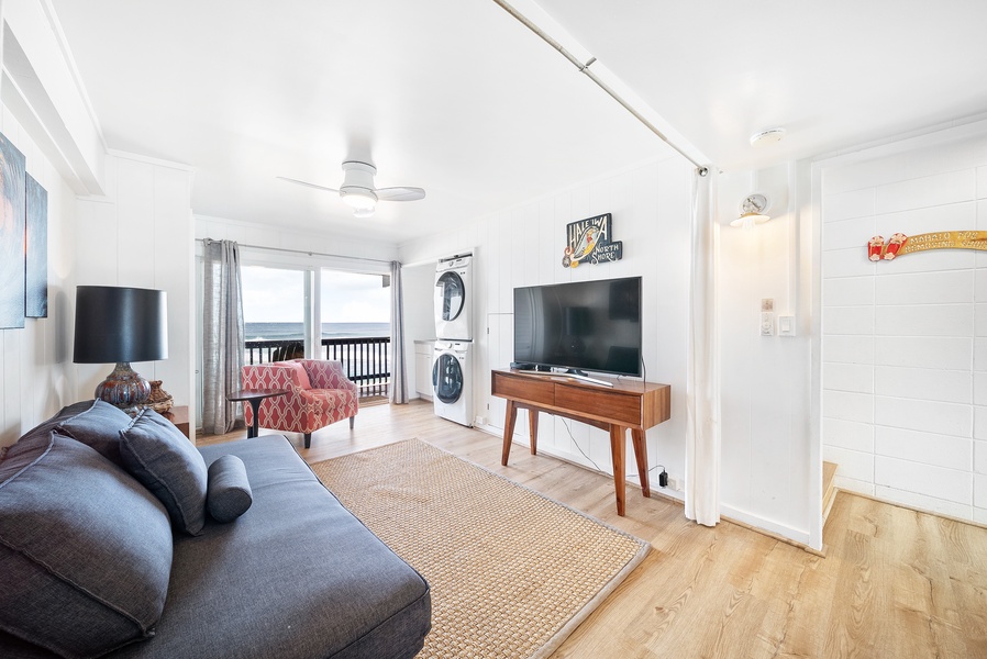 This entertainment space has direct access to the lower-level beach front deck