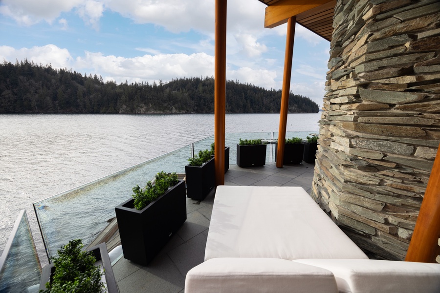 Unwind on your private waterfront terrace where soft cushions meet stunning lake views, creating your perfect lakeside retreat.