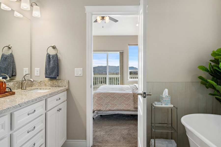 Ensuite bathroom serenity meets breathtaking balcony vistas as you open the door