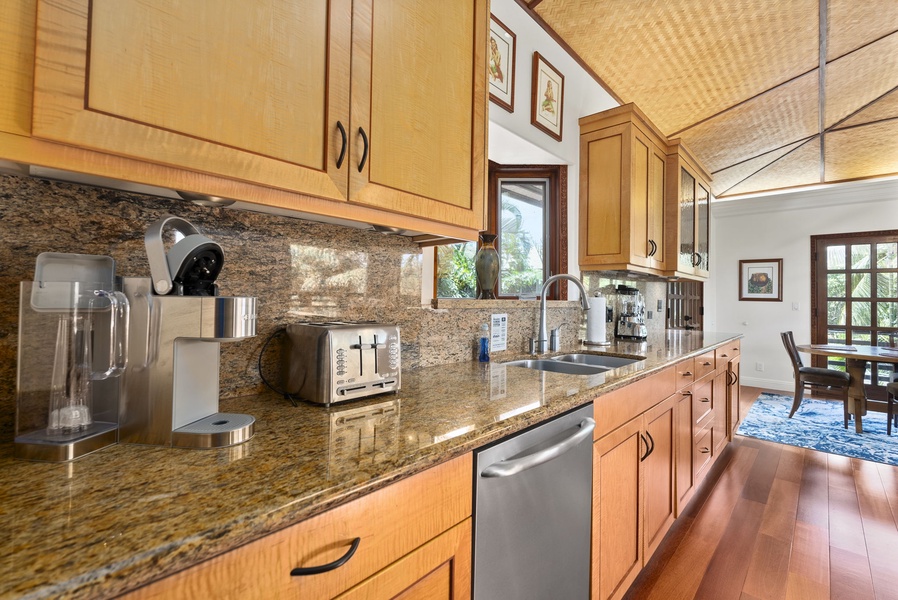 The gourmet kitchen features wide countertops and stainless steel appliances.