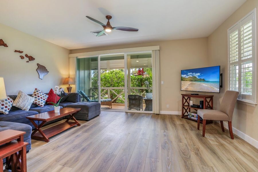 The living area looking to the lanai with garden views.