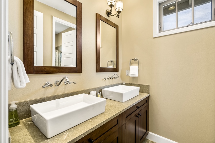 Upstairs guest bathroom with dual vanities