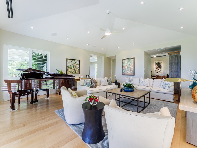 Step into paradise with an open-concept floorplan, where plush furnishings beckon for relaxation and conversation flows seamlessly.