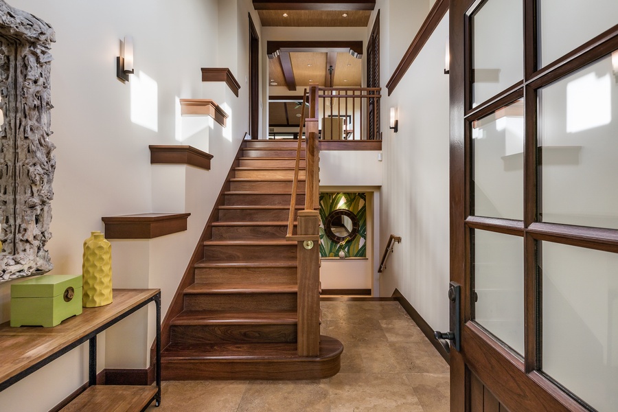 The elegant foyer and staircase greets you upon your entrance. Great room and kitchen are upstairs, bedrooms are downstairs.