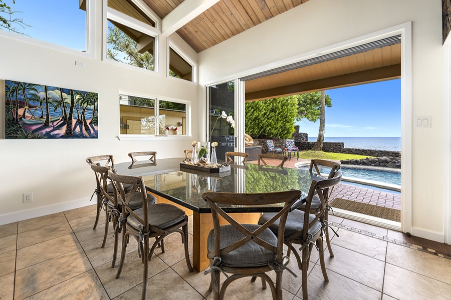 Indoor dining featuring Lanai access and ocean views