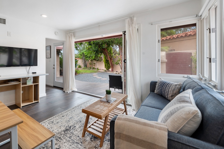 Casita living room with comfortable couches and access to the patio