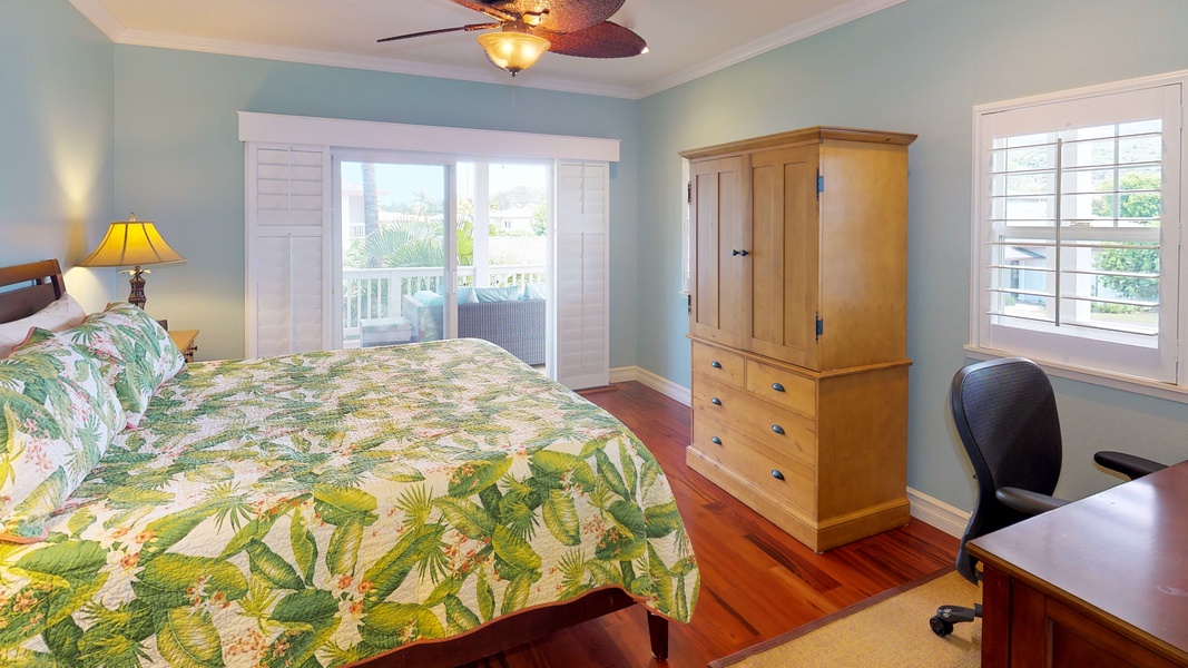 The guest room with ceiling fan and private lanai.