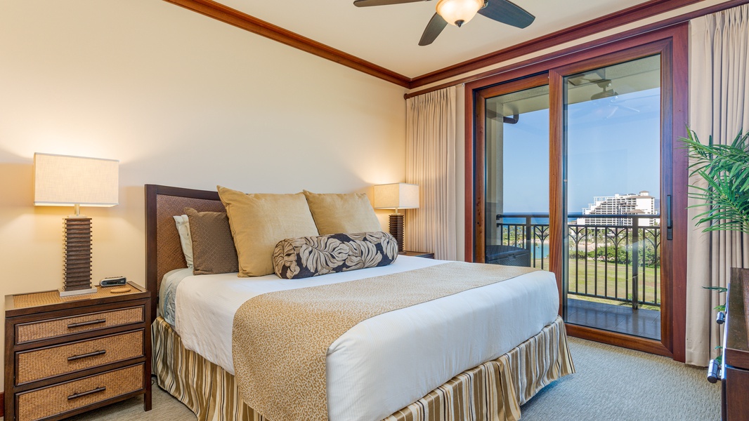 Wake up to breathtaking ocean views from your plush king bed in the elegant primary suite.