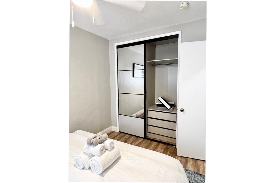 The guest bedroom offers large mirror closet to store your getaway essentials.