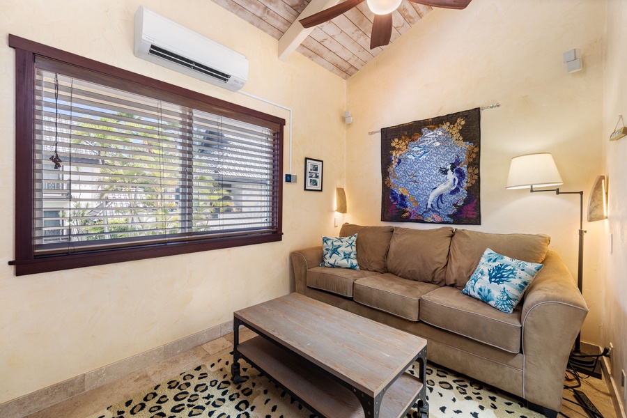 Alternate view of the library with artful decor and sofa sleeper—relax or catch up on your favorite book.