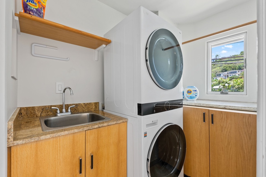 A laundry area with a washer and a dryer for convenience.