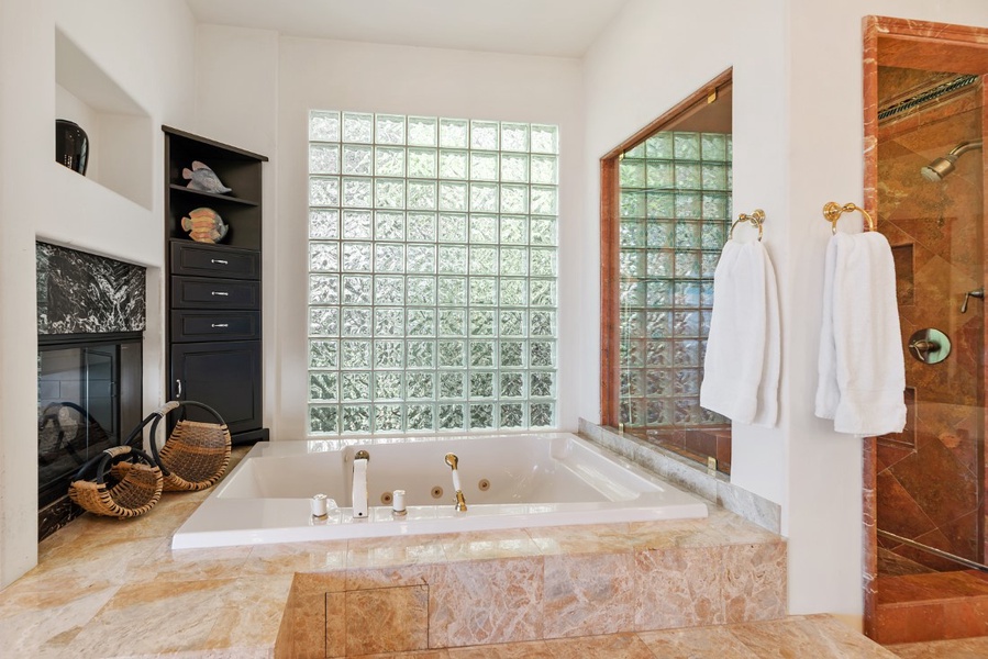 Primary bathroom jetted tub and glass shower