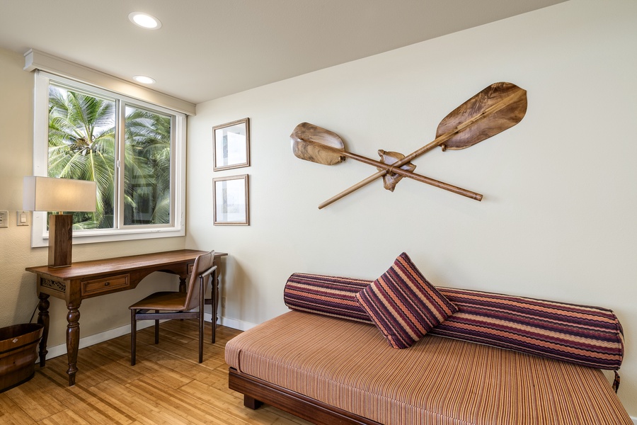 Additional twin bed and writing desk in the primary suite—ideal for kids or remote work.