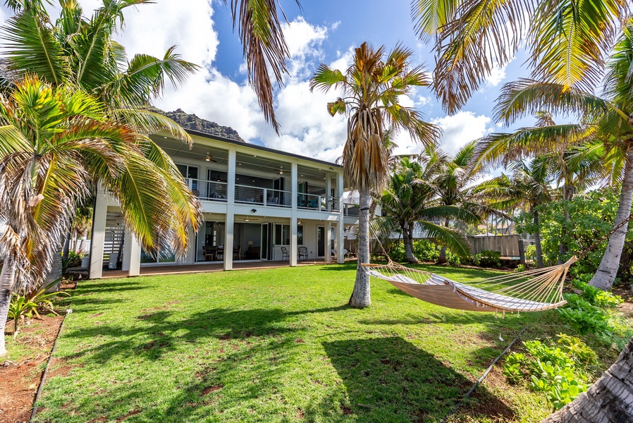 View of the estate from the ocean side shows its scale, privacy, and manicured surroundings.