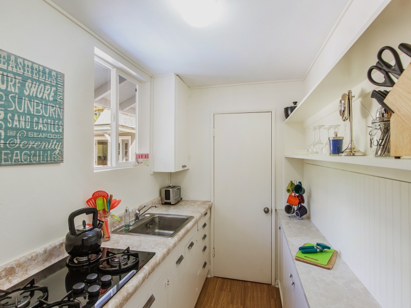 The spacious kitchen with an attached laundry room for added convenience.