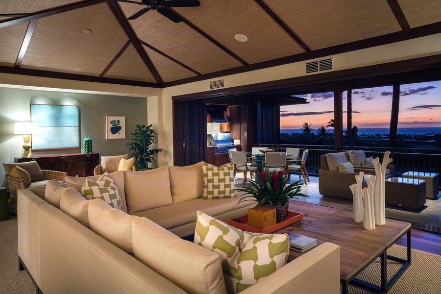 Enjoy colorful tropical sunsets in comfort with seamless transition between indoor and outdoor living spaces.