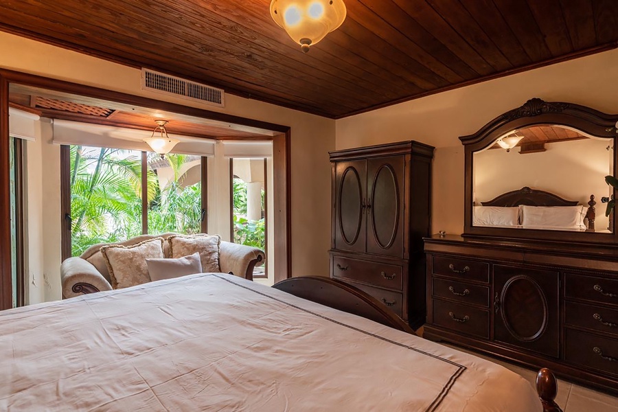 Relax on the cozy seating area with garden views for a relaxing retreat.