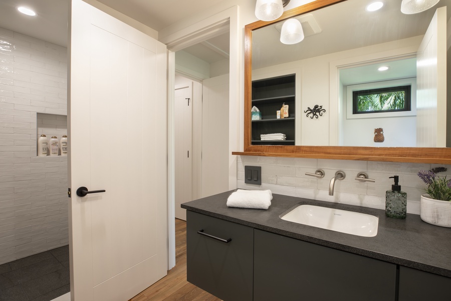 Contemporary bathroom featuring sleek fixtures and a luxurious layout.