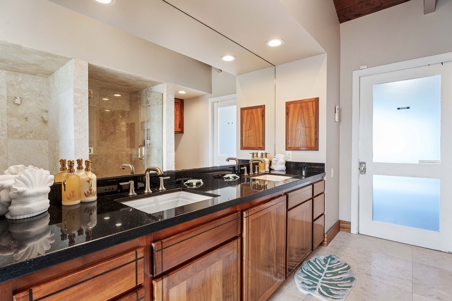 Dual vanities with Koa cabinets and granite counters