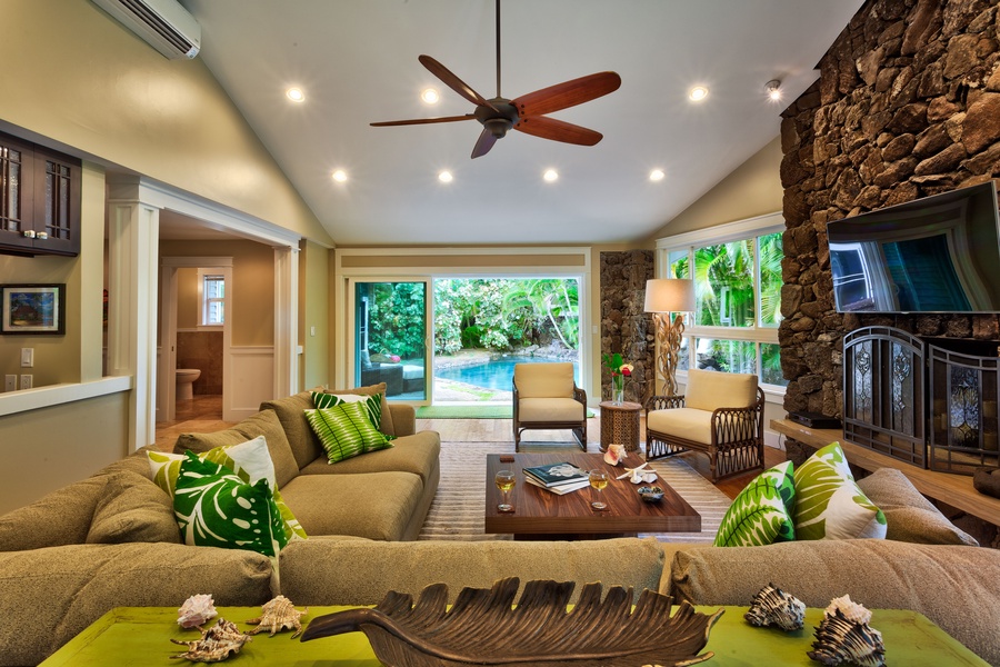 Cozy up in the living area, which is between the pool, kitchen and barbecue areas - central to all of the action!
