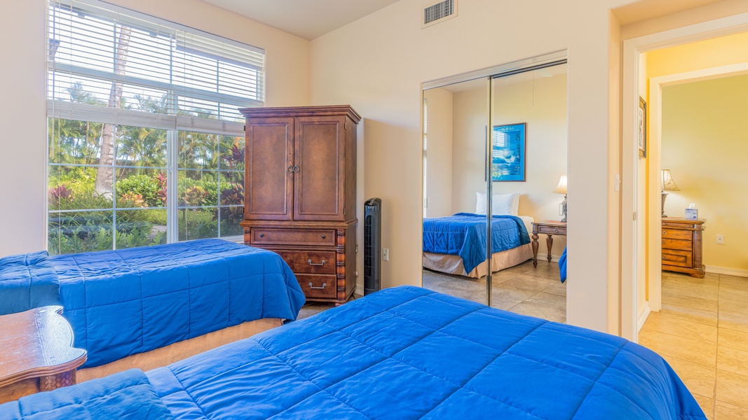 The third guest bedroom features storage and views.