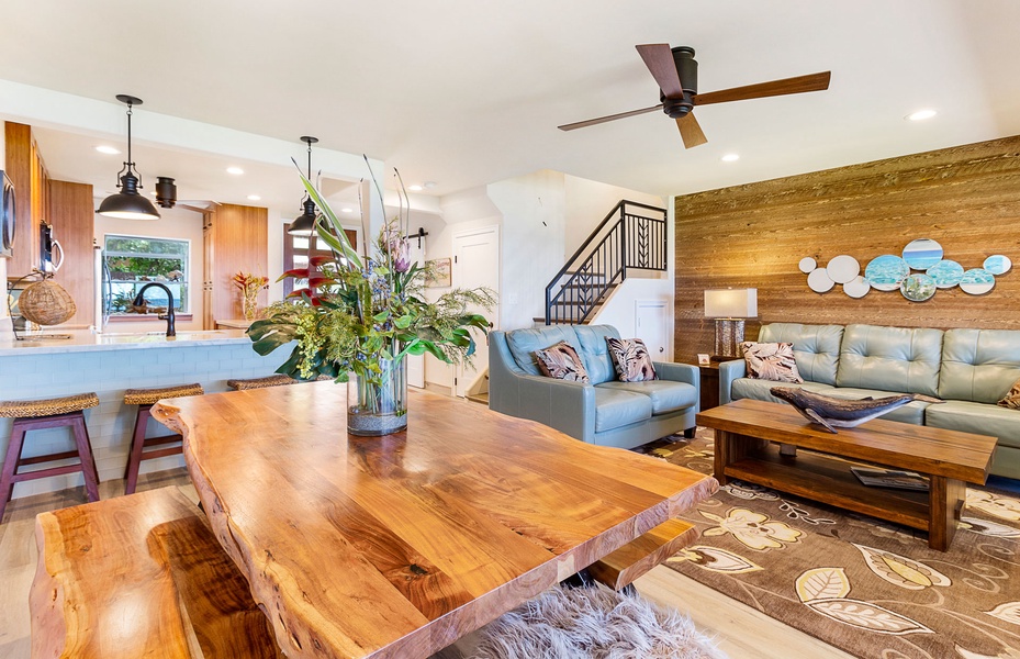 Dining area with vibrant tropical accents and seamless access to the kitchen and living space.