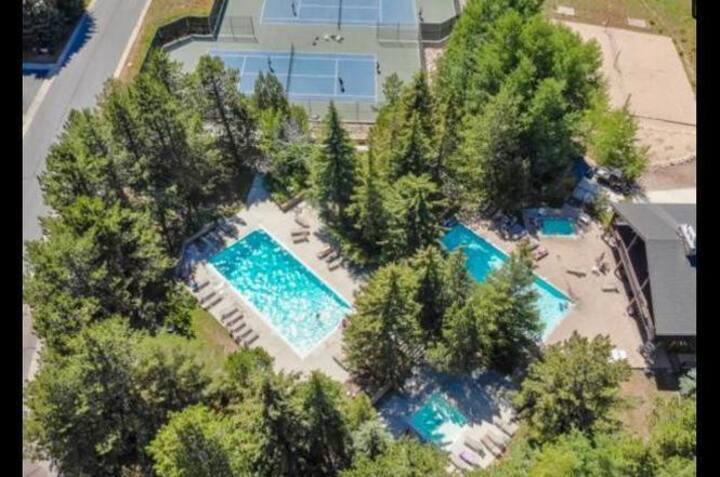 Condo amenities featuring the heated outdoor pools