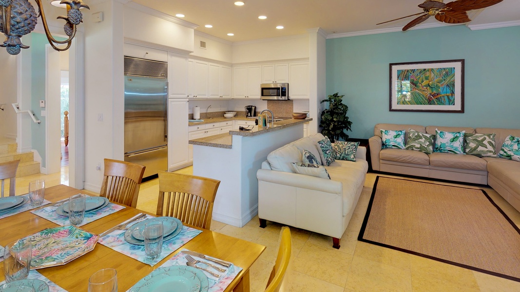 The kitchen is open to dining room and living areas.