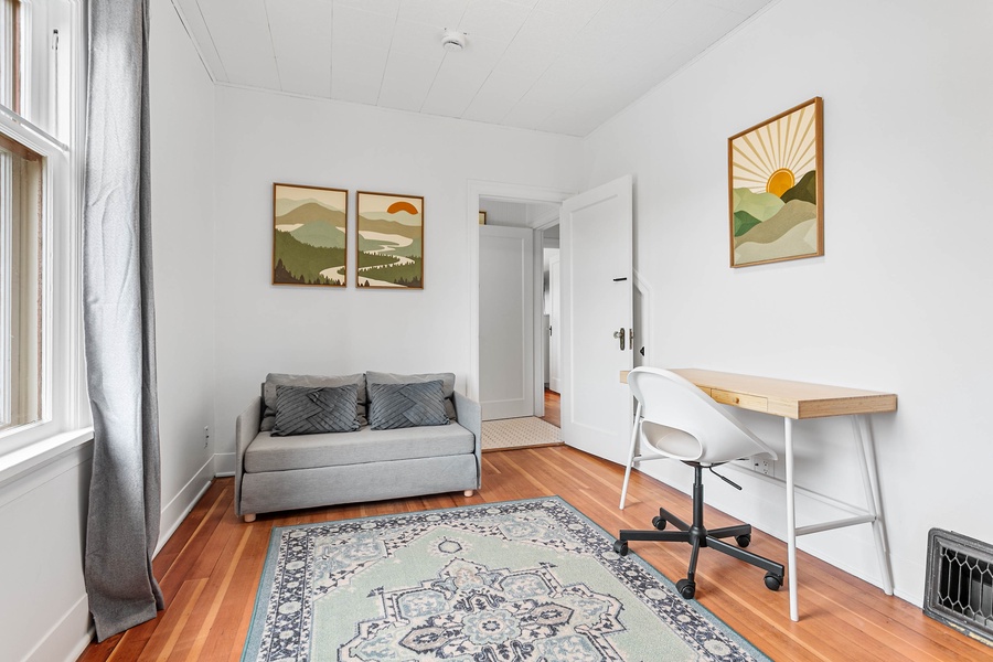 An airy bonus room with a dedicated desk makes remote work a breeze while maintaining a cozy vibe.