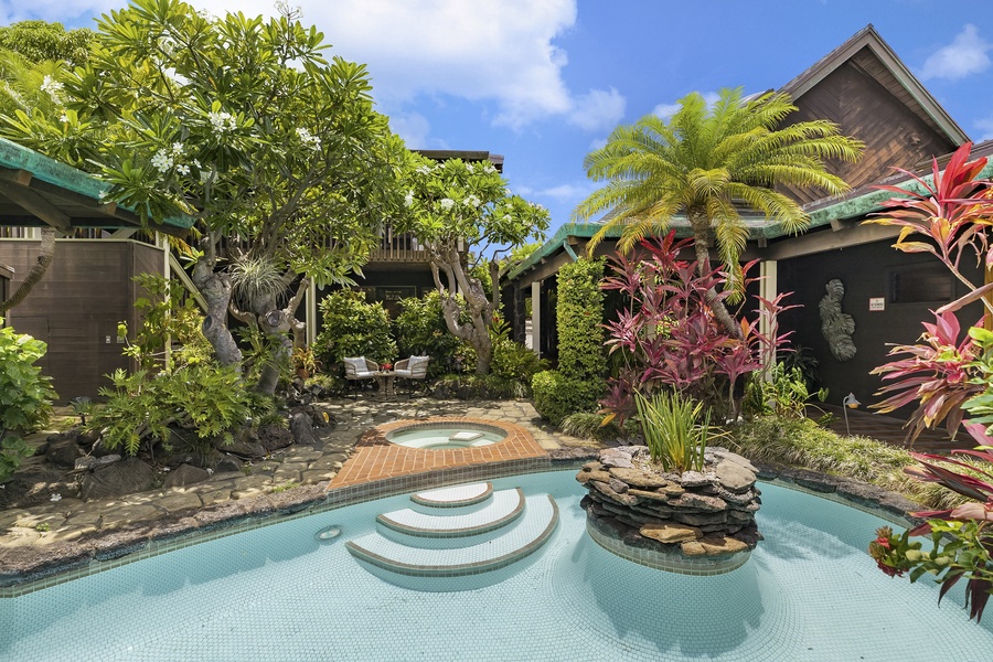 Home is centered around a large courtyard with lush tropical landscaping and resort-style pool and jacuzzi.
