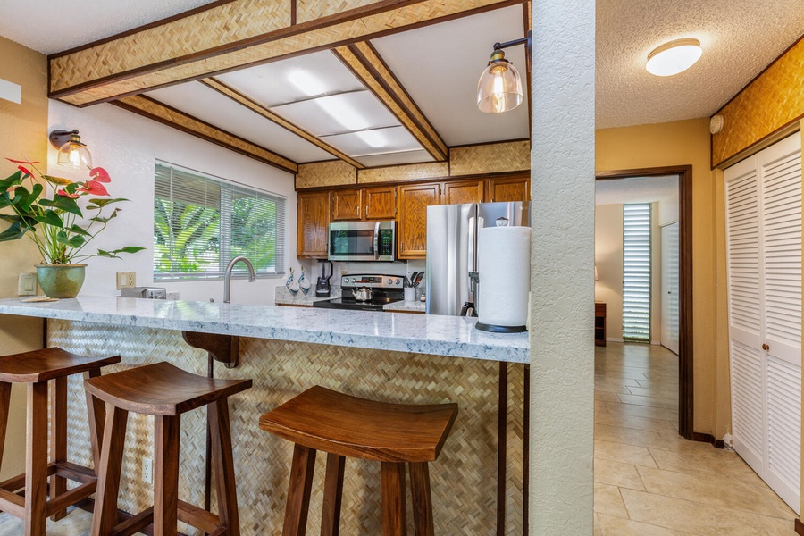 Savor quick meals and entertainment at the kitchen island/bar.