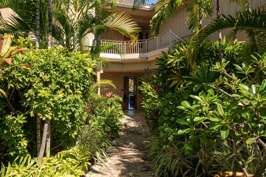 Private tropically landscaped entrance path to villa.