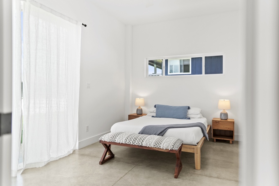 The guest suite downstairs features a plush queen-sized bed for ultimate comfort.