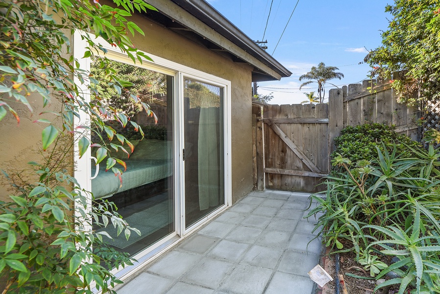 Access the wraparound patio from the primary bedroom sliders.