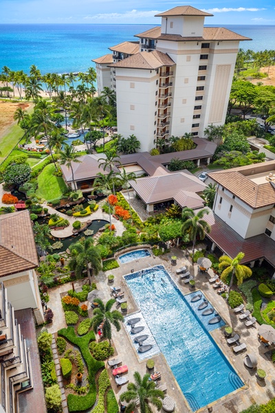 Resort pool view from the lanai with a glimpse of the ocean