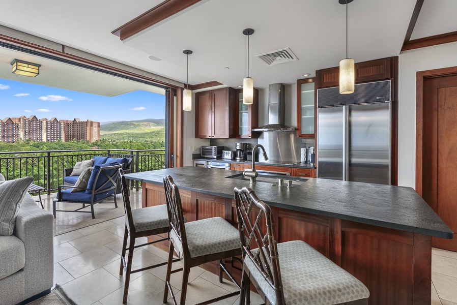 Cook with ease in your modern kitchen while soaking up stunning mountain views through floor-to-ceiling windows that frame the scenic landscape beyond.