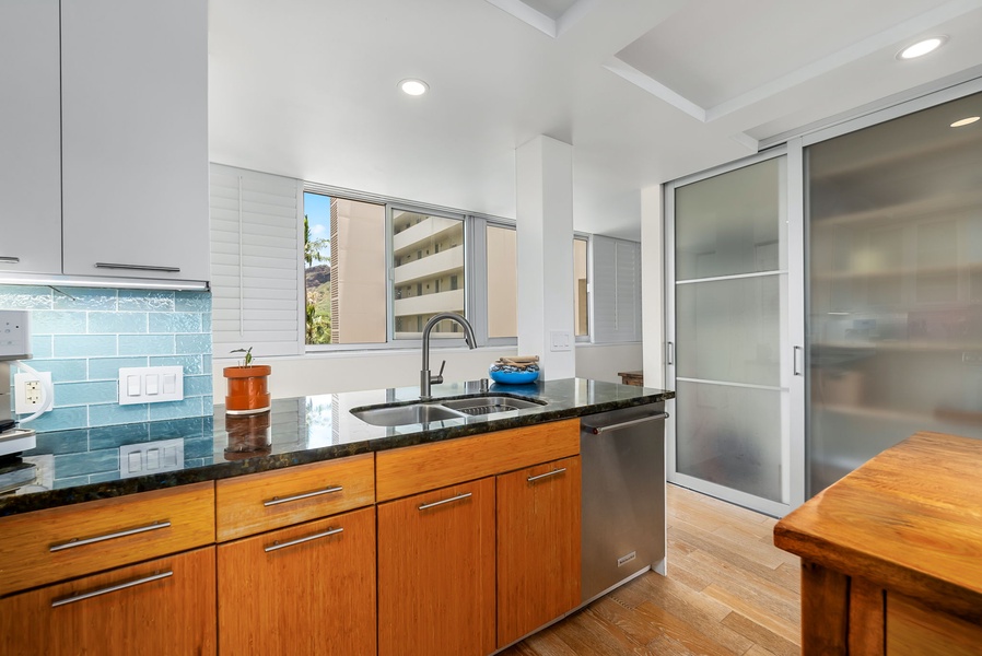 Ocean breeze fills this thoughtfully designed kitchen space with clean lines and natural light.