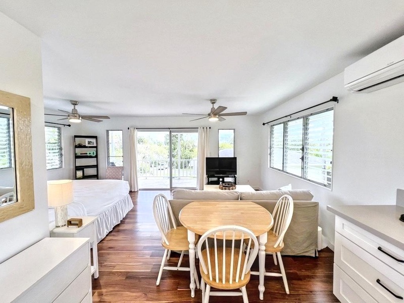The guest cottage offers a king bed, pull-out sofa, full bath, lanai, wet bar, and brand-new air conditioning.