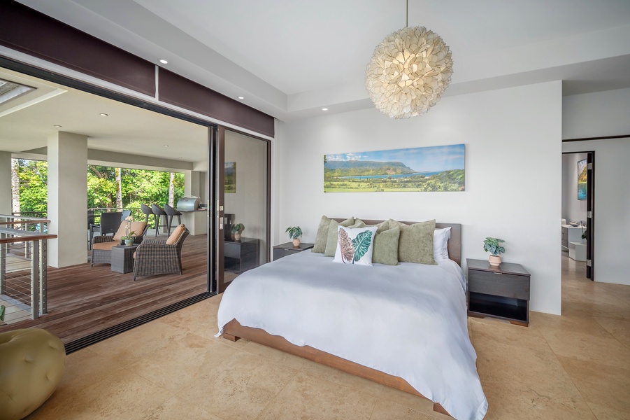 "Hanalei Bedroom" with direct access to the lanai, offering peaceful views and fresh air.