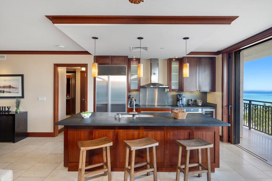 Host family meals or casual bites at the oversized island with seating for four.